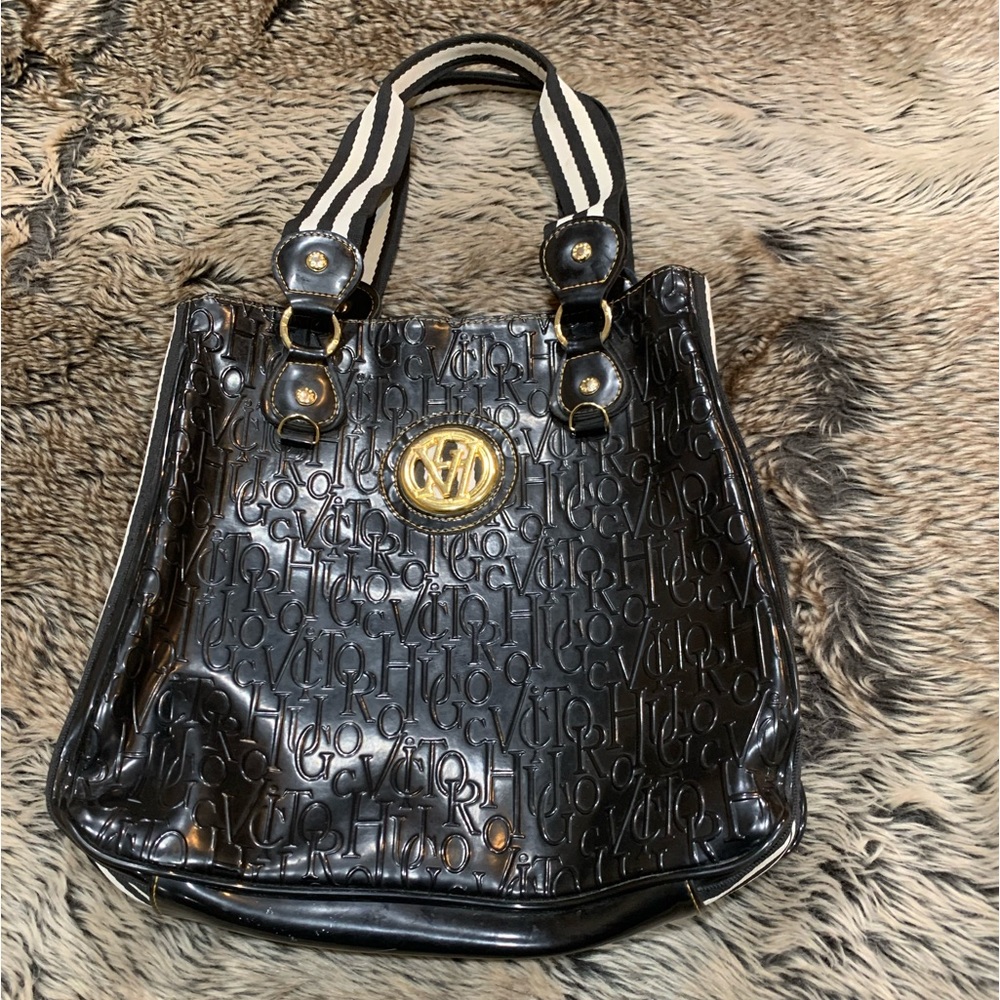 Victor Hugo, large Rare embossed black patented leather logo stamped purse.